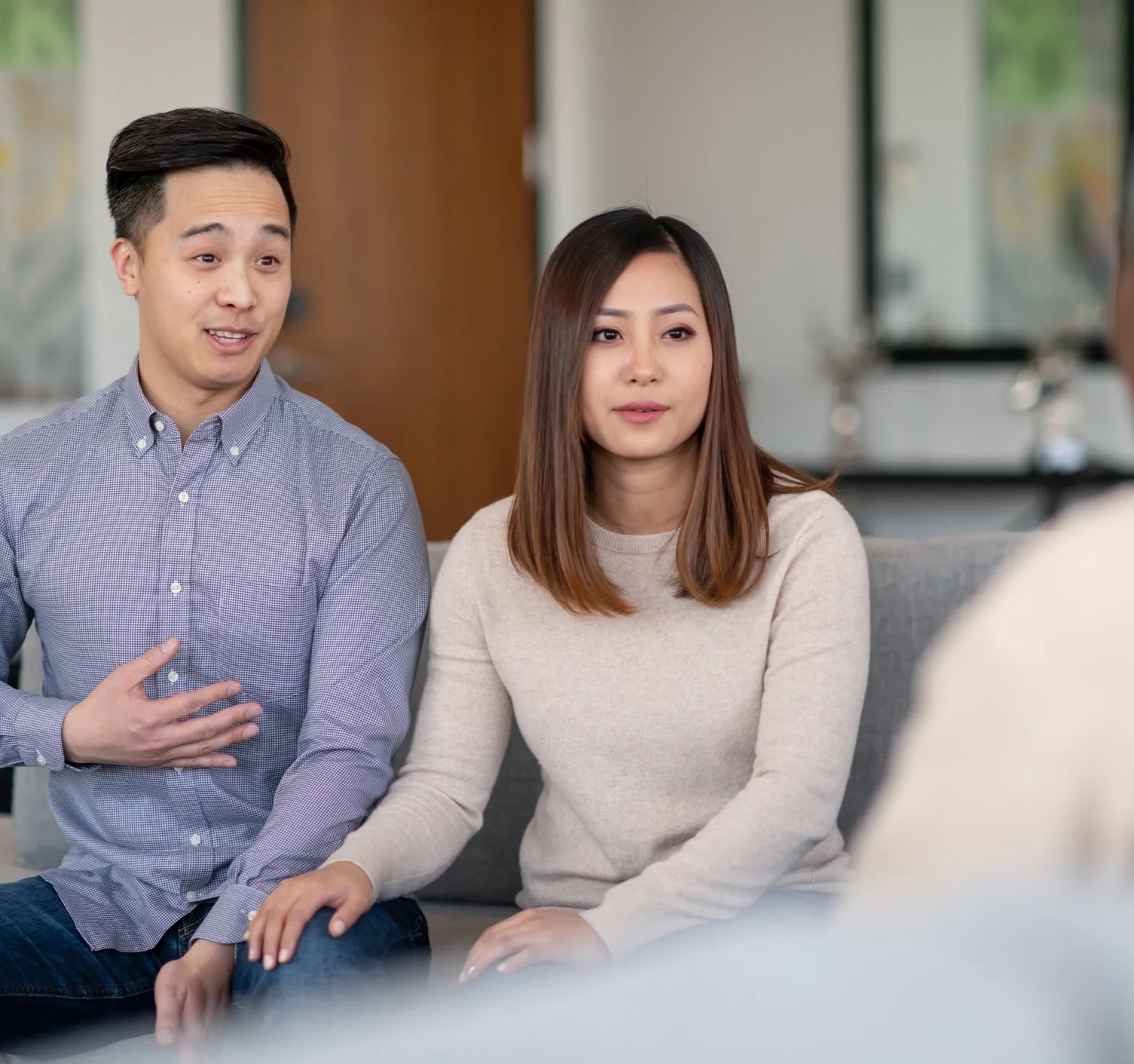 Couple holding hands in therapy